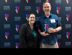 Dan accepting an award at ceremony